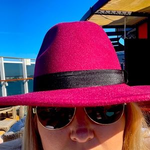 It’s a hat. Very pretty burgundy hat worn once on a cruse.